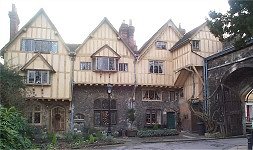 15th/16th Century Cheyney Court. Adjoining south entrance gate to Close. 2 and 3 storeys. Stone ground floor walls, with overselling timber-frame and plaster infill above. 3 gabled front to Close. Old tile roof. Close wall forms part of back of house. 