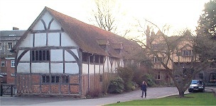 13th/14th Century Pilgrims' Hall. Early hammer-beam roof. Inserted floor, modern windows and entrance. Important 3-bay roof with reputedly the earliest hammer- beam known. Half-hipped tile roof.