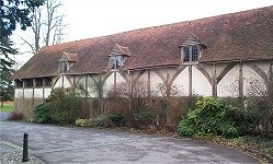 13th/14th Century Pilgrims' Hall. Early hammer-beam roof. Inserted floor, modern windows and entrance. Important 3-bay roof with reputedly the earliest hammer- beam known. Half-hipped tile roof.