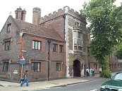 St John's South  C.19 St. John's Hospital. Dated 1817, 1831 and 1833 on rainwater heads. 2 storeys with 3-storey tower at entrance. Grey brick walls with red diaper pattern and dressings. Stone quoins. Arch to main entrance. Machiolations on tower. Tiled roof, chimneys in clusters of octagonal shafts. Recent alterations. 