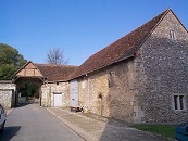 View across the Outer Quadrangle to the16th Century Outer Gate and the 14th Century Old Brewhouse (The site of the Hundred Mens Hall)