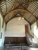 The Brethren's Hall showing the steps leading to the old Master's Lodgings, the raised platform and the chacoal fired central hearth.