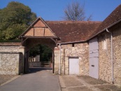 View across the Outer Quadrangle to the16th Century Outer Gate and the 14th Century Old Brewhouse (The site of the Hundred Mens Hall)