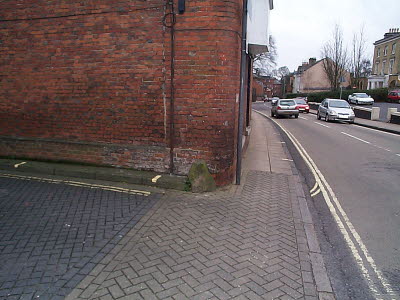 On the corner of St Cross Road and Canon Street.